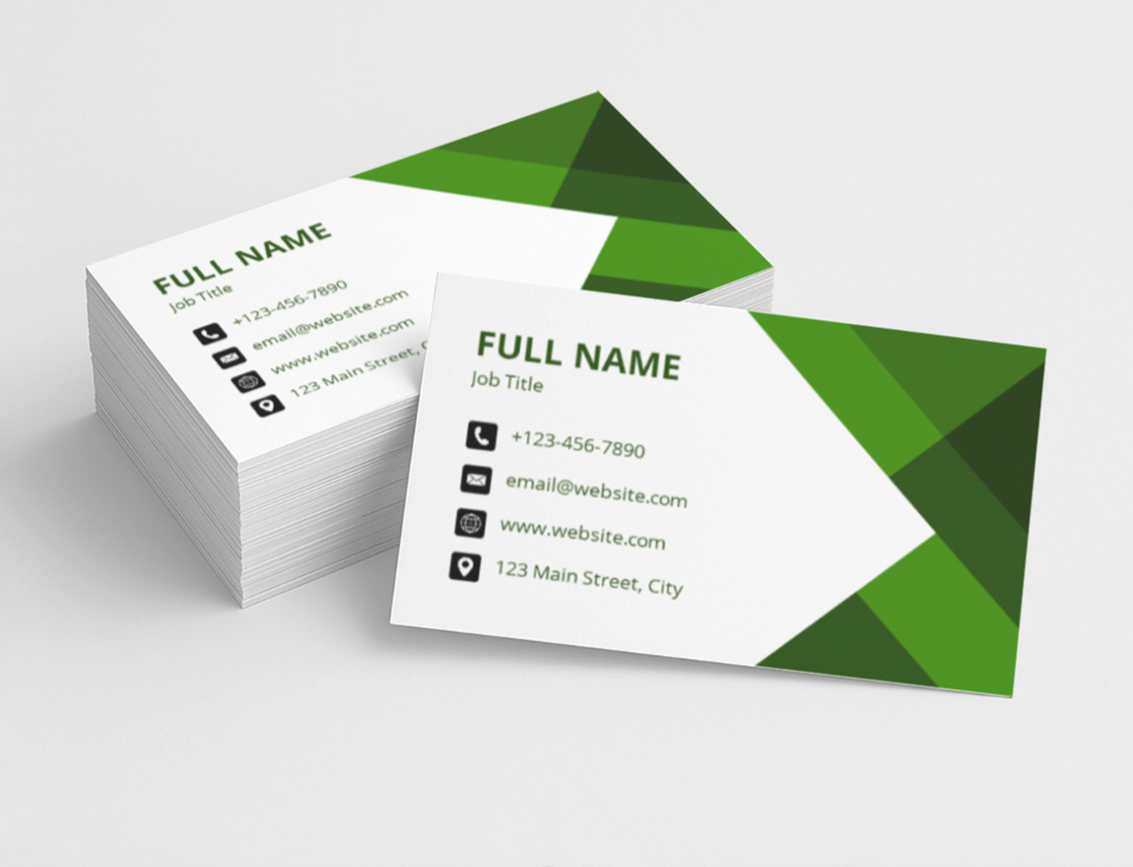 Green and white geometric business cards on a light gray background