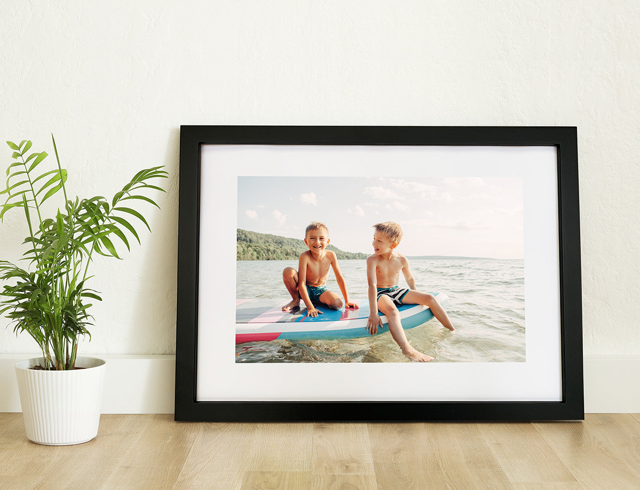 Photo of a Framed Print or Framed Poster positioned on a desk