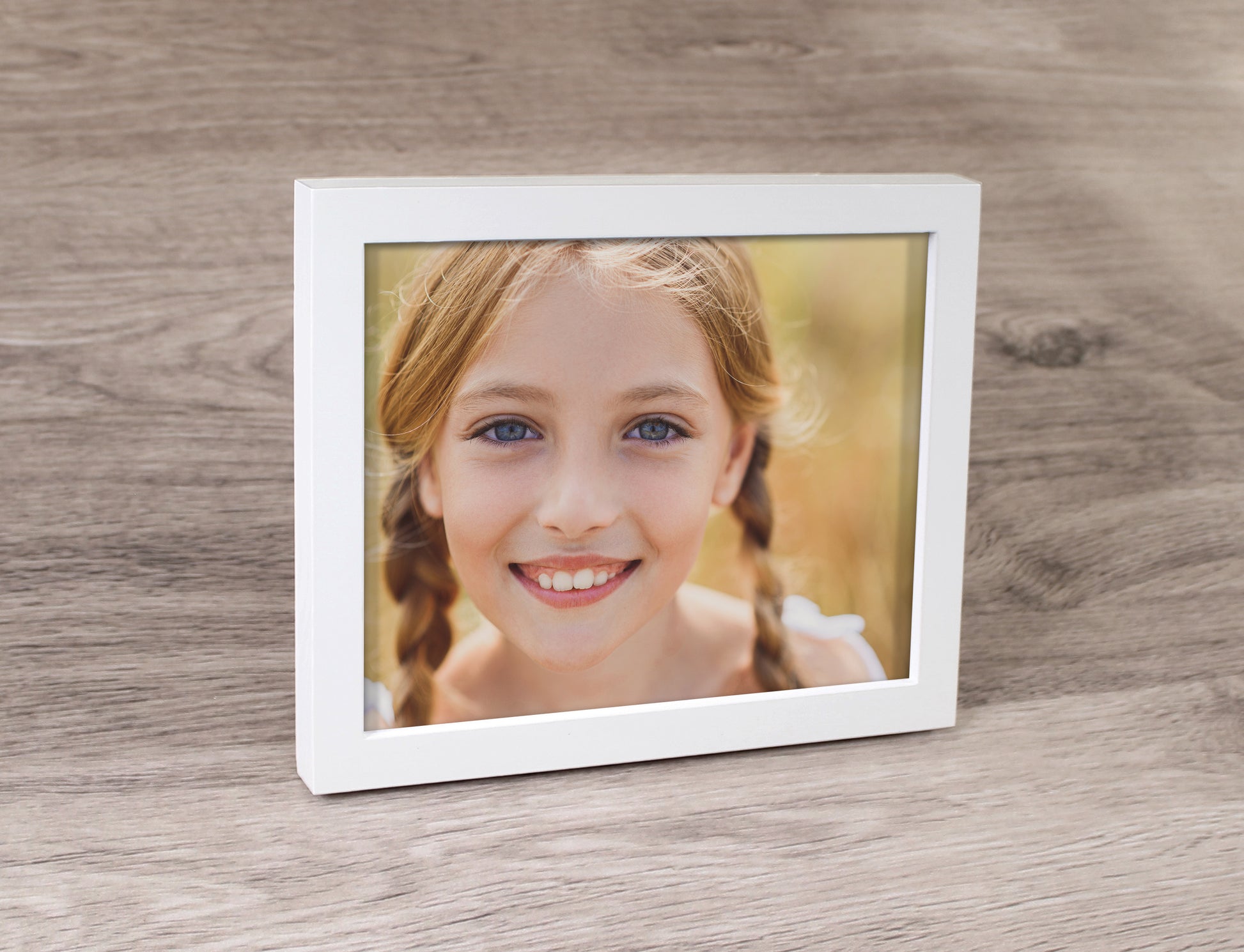 Framed Print with a white frame and photo of a girl