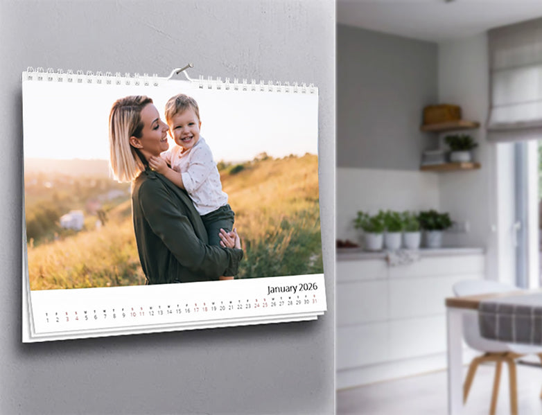 Custom A3 landscape gallery photo wall calendar, spiral-bound, hanging on a wall