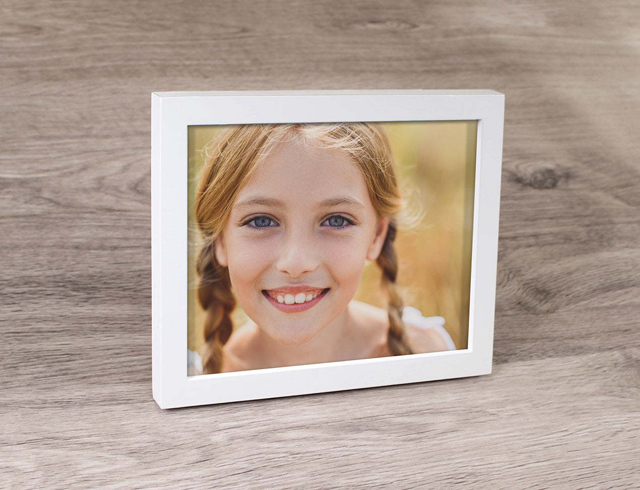 Framed Prints with portrait picture of kid in thick white frame