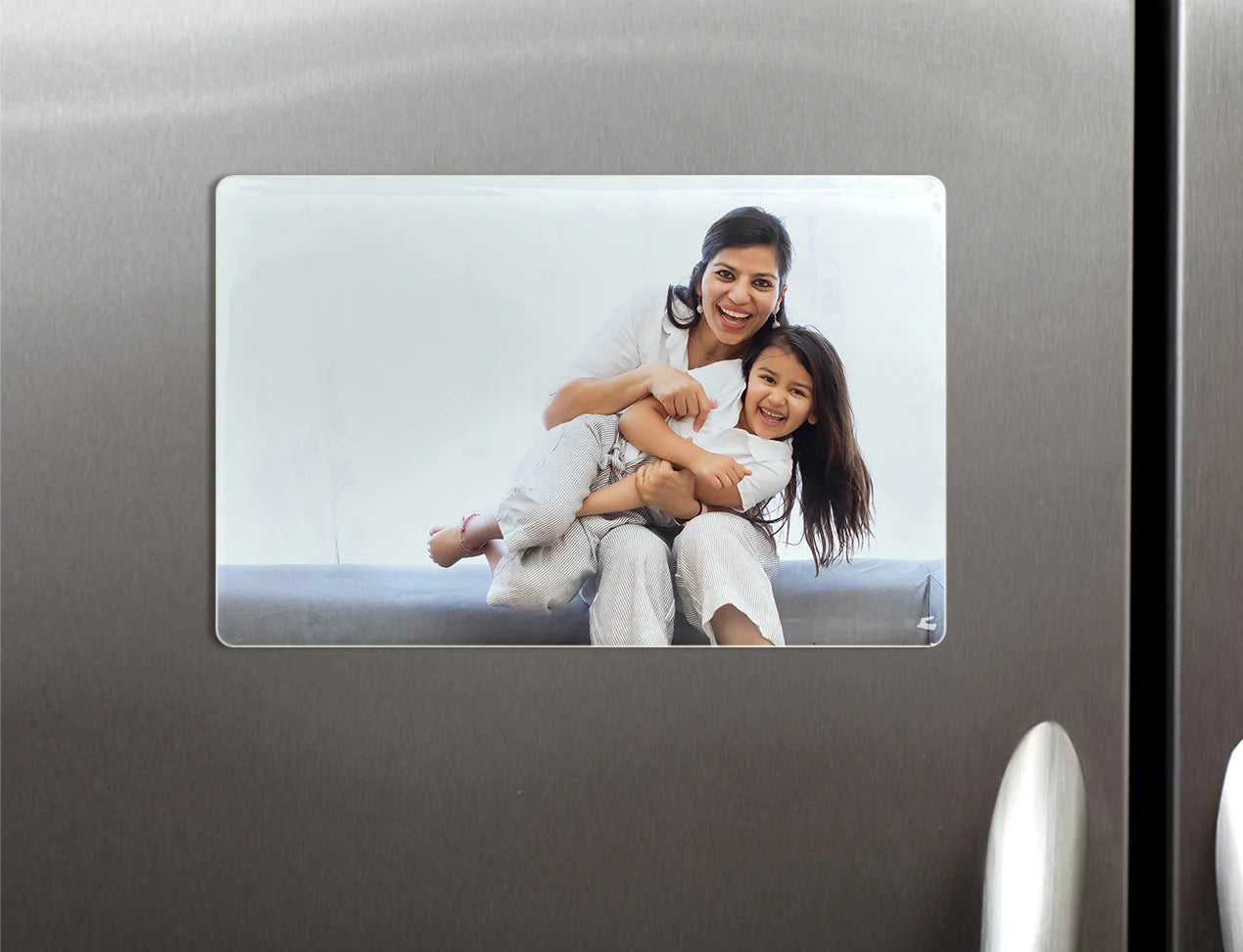 Porcelain Photo magnet displayed on fridge
