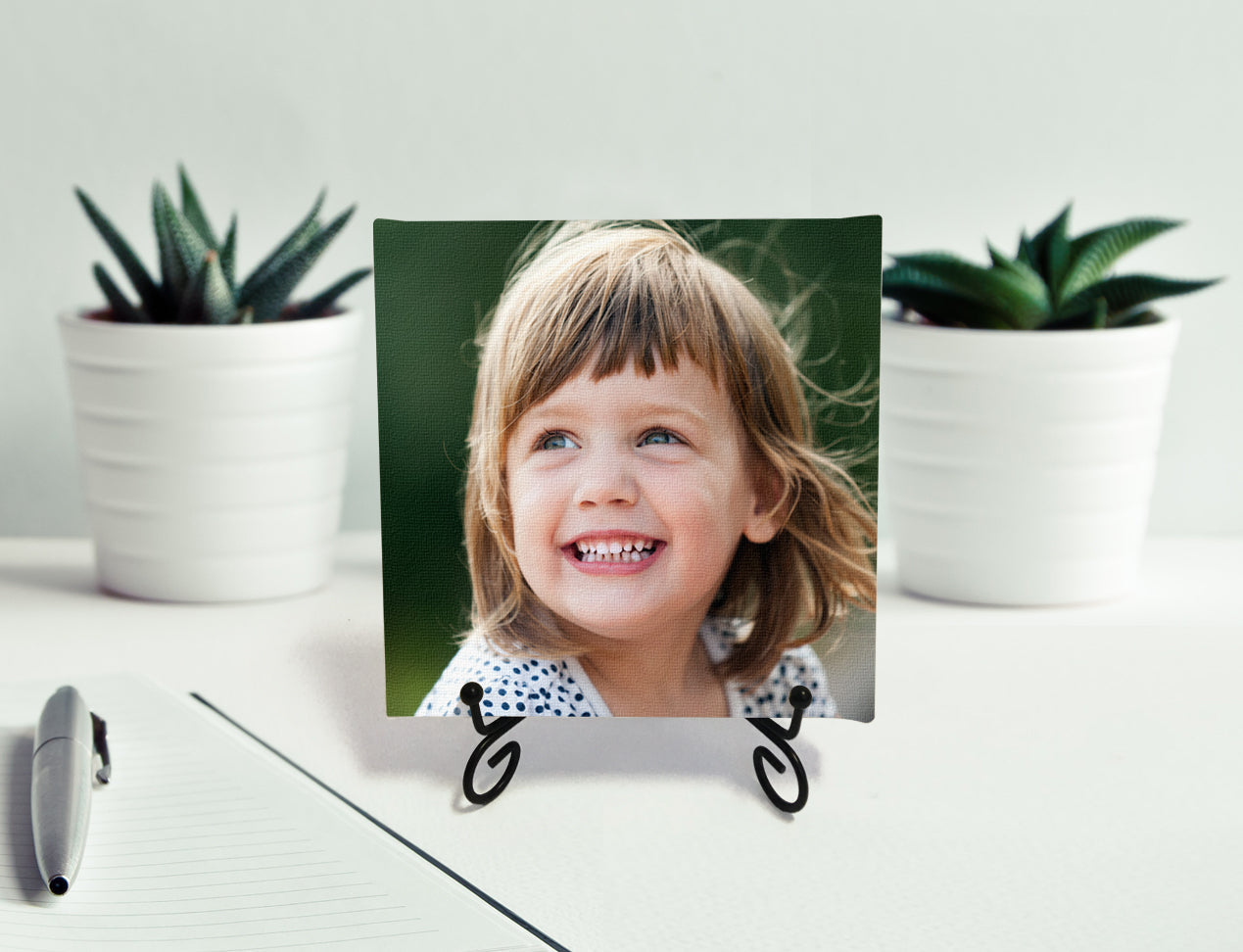 Table-top Canvas print with kids photo on metal easel. This is an elegant Mini Canvas Print on display.