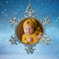 Custom star-shaped Xmas decoration personalised with a baby in a yellow outfit against a snowy background