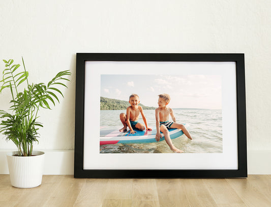 Photo of a Framed Print or Framed Poster positioned on a desk