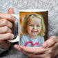 Mother holding a Custom Photo Mug which is customised with image of kid