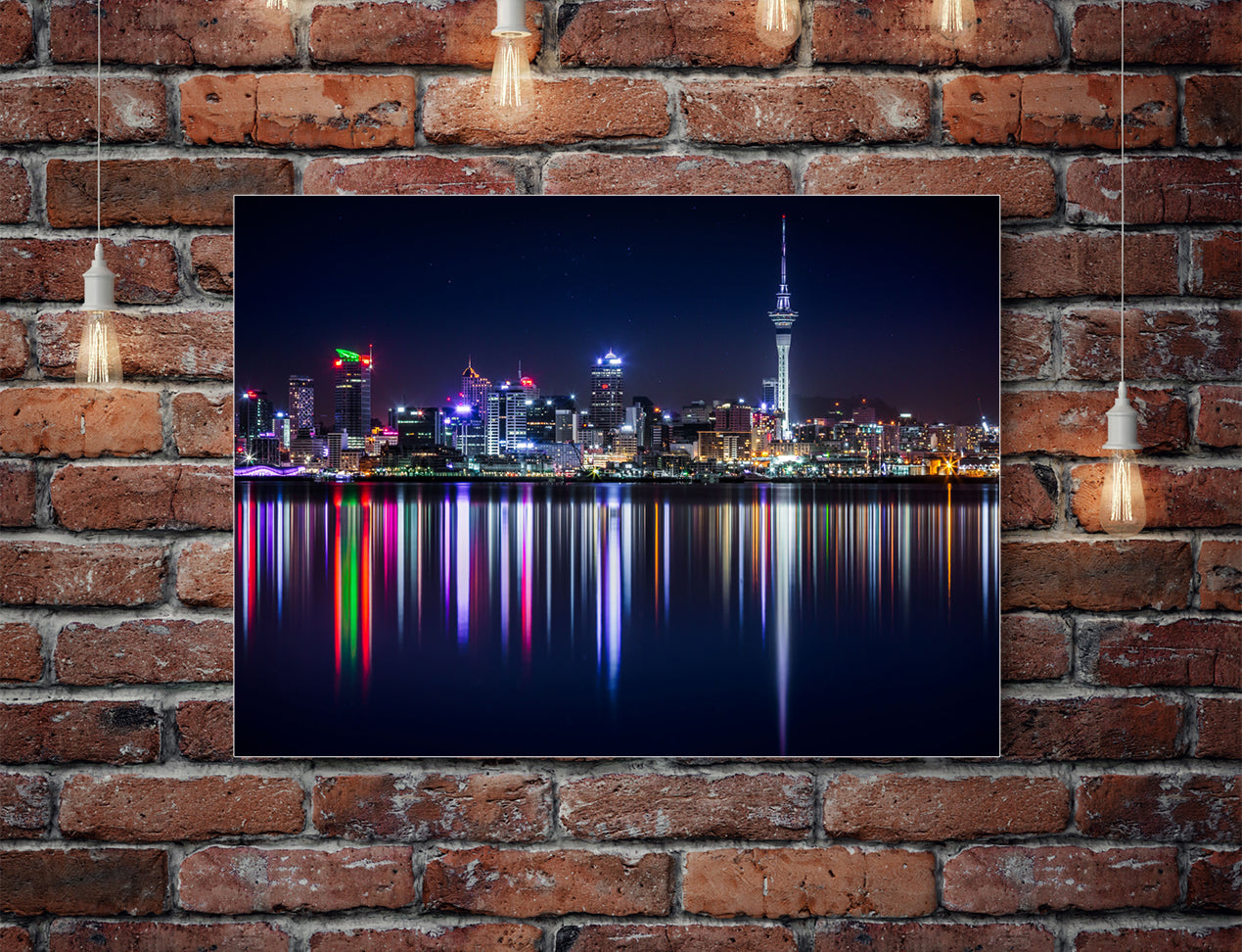 Metal Print with skyline image hanging on brick wall