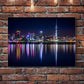 Metal Print with skyline image hanging on brick wall